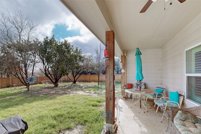 view of yard featuring ceiling fan and a patio area