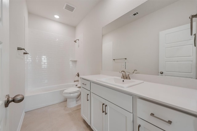 full bathroom featuring toilet, tile patterned flooring, vanity, and tiled shower / bath