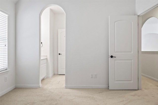 carpeted spare room with plenty of natural light