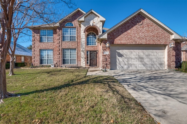 view of front of house featuring a garage and a front yard