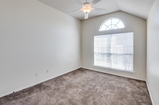 carpeted empty room with ceiling fan and lofted ceiling