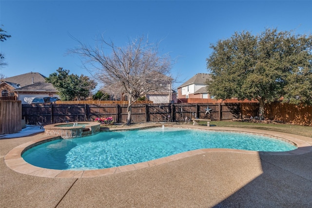 view of pool featuring pool water feature and an in ground hot tub