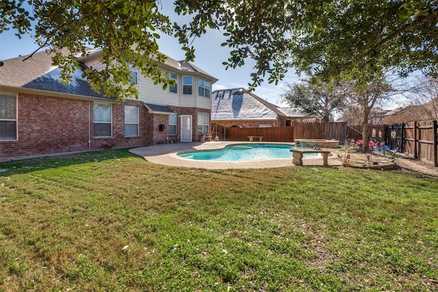 view of pool featuring a patio area and a yard