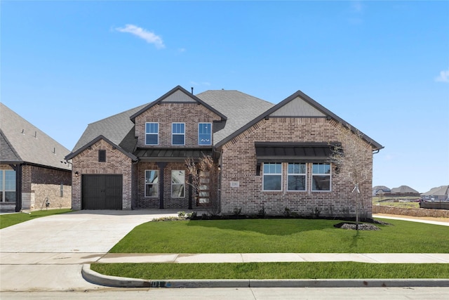 view of front of property featuring brick siding, concrete driveway, a front yard, and a shingled roof