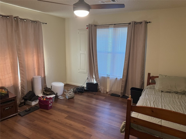 bedroom with hardwood / wood-style flooring and ceiling fan