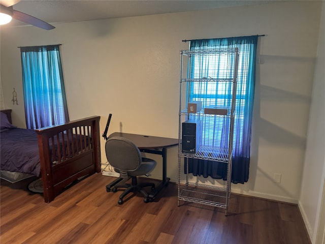 bedroom with hardwood / wood-style flooring and ceiling fan