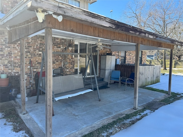 view of snow covered patio