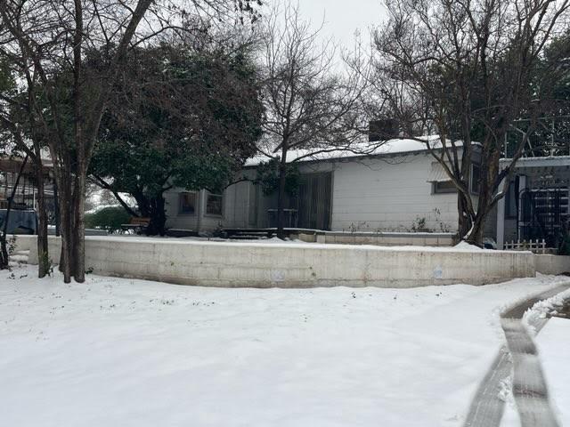 view of yard covered in snow