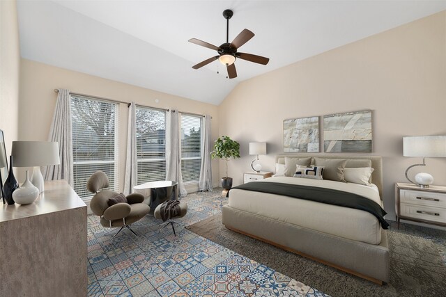 bedroom featuring ceiling fan and lofted ceiling