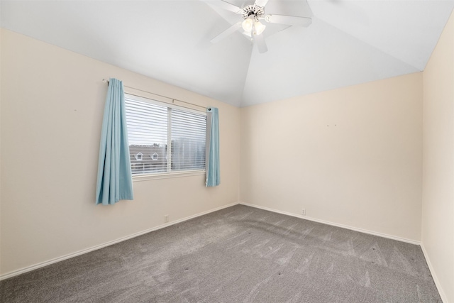 spare room with vaulted ceiling, ceiling fan, and carpet flooring