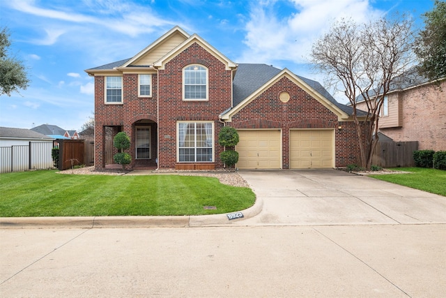 view of property with a front yard and a garage