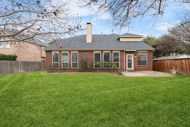 back of house with a patio and a lawn