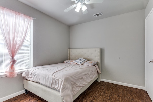 bedroom featuring ceiling fan and dark hardwood / wood-style flooring