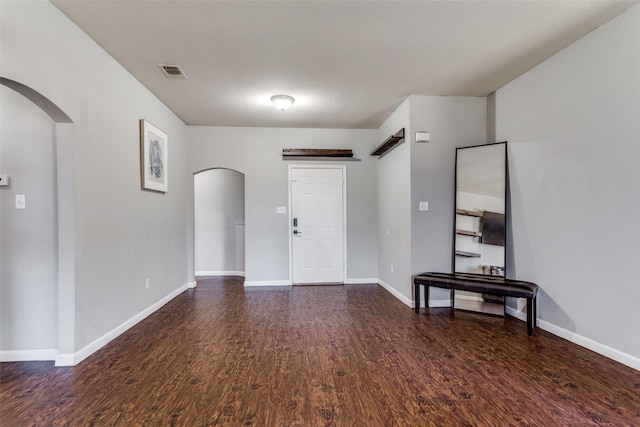 foyer featuring dark hardwood / wood-style floors