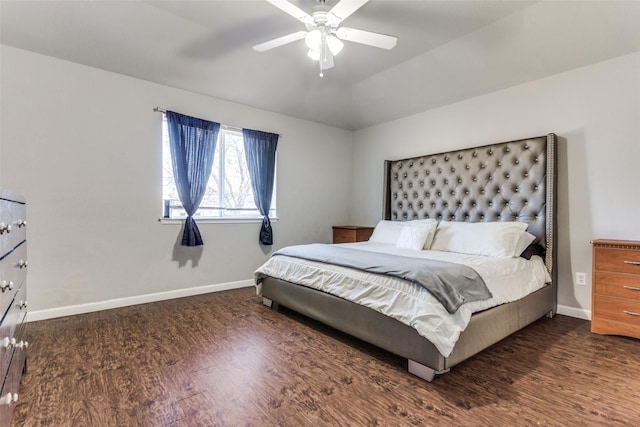 bedroom with ceiling fan, dark hardwood / wood-style flooring, and lofted ceiling