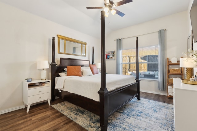 bedroom with ceiling fan, dark wood-type flooring, and vaulted ceiling