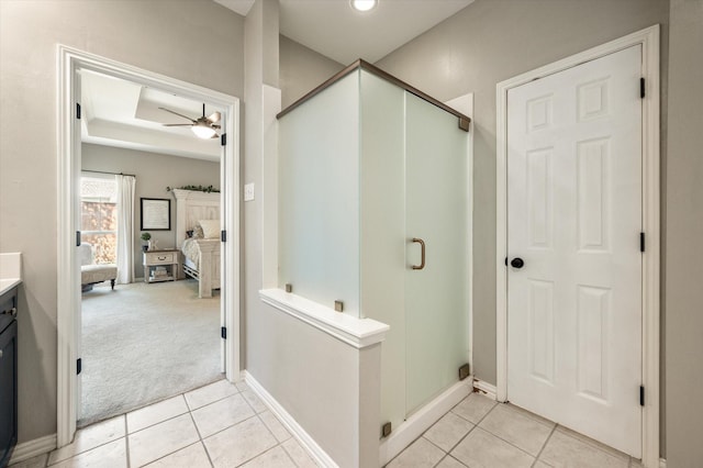 bathroom with vanity, a shower with door, tile patterned floors, and ceiling fan