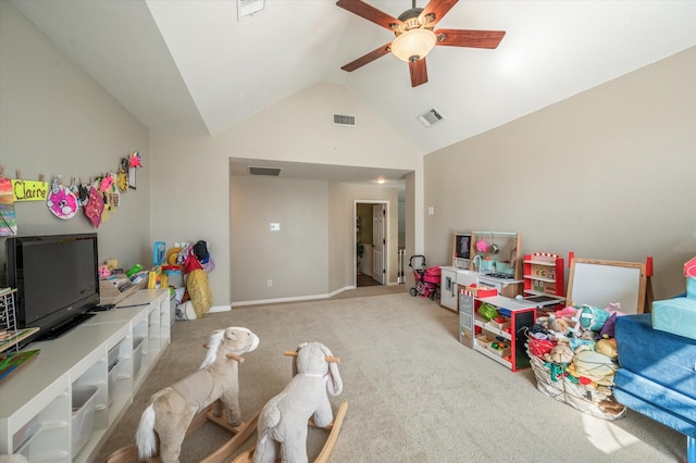 playroom with ceiling fan, light colored carpet, and vaulted ceiling