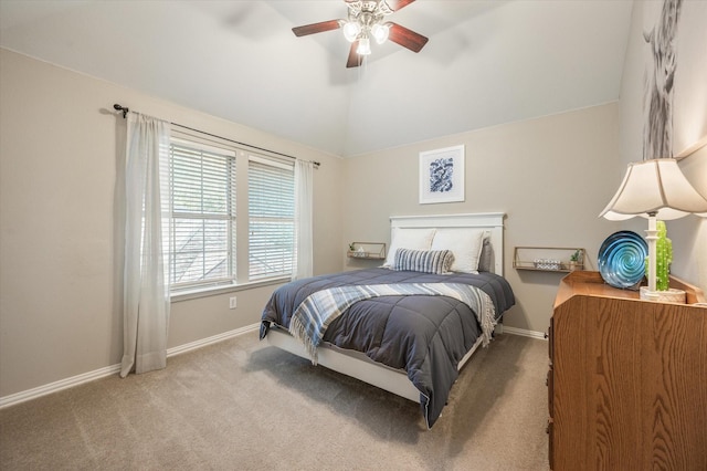 bedroom featuring light carpet, vaulted ceiling, and ceiling fan