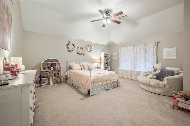 carpeted bedroom with a raised ceiling, ceiling fan, and vaulted ceiling