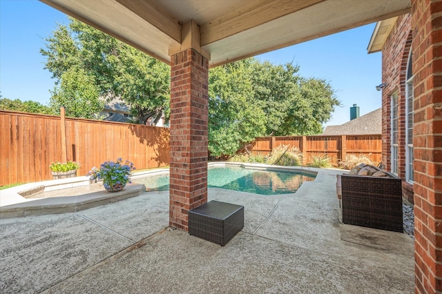 view of swimming pool featuring a patio