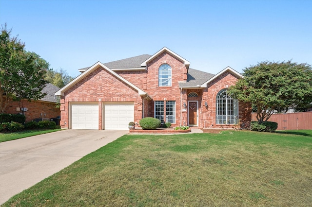 front facade featuring a front yard and a garage