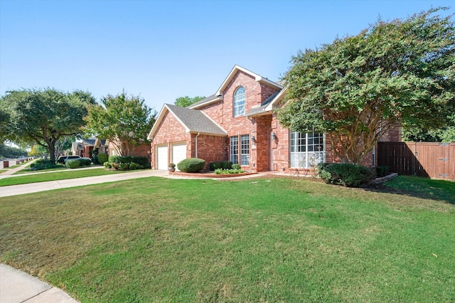 front of property with a front yard and a garage