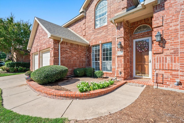 entrance to property featuring a garage