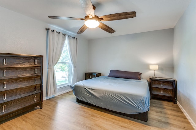 bedroom featuring ceiling fan and light hardwood / wood-style flooring