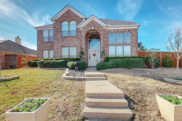 front facade featuring a front yard