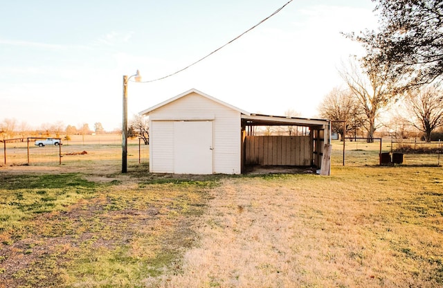 view of outdoor structure featuring a lawn