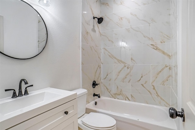 full bathroom with tiled shower / bath combo, toilet, and vanity