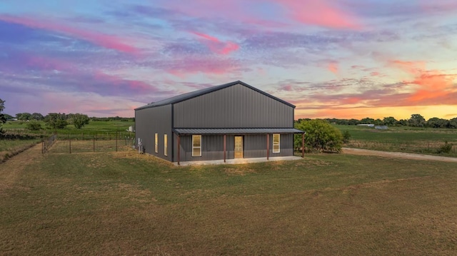 exterior space with an outbuilding and a yard