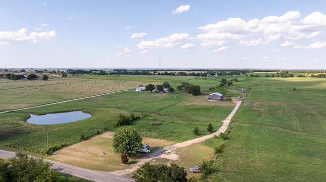 drone / aerial view with a rural view and a water view