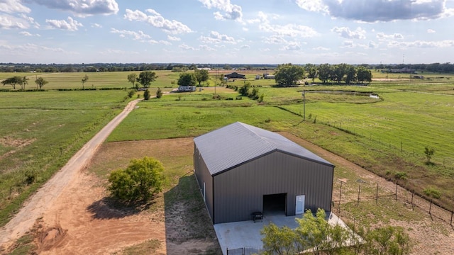 birds eye view of property with a rural view