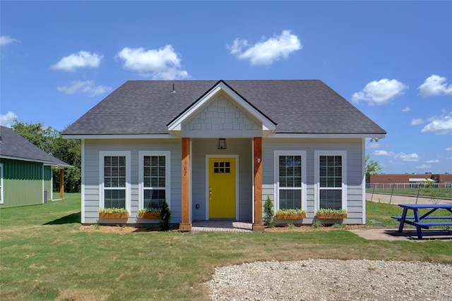 bungalow featuring a porch and a front yard