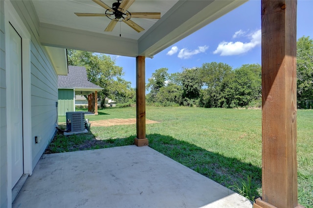 view of yard with central AC, ceiling fan, and a patio area