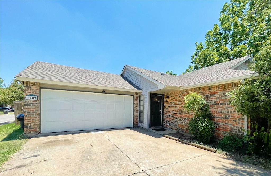 ranch-style home with a garage