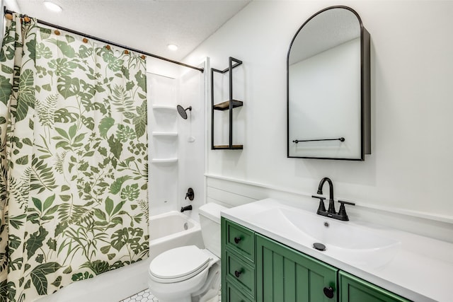 full bathroom featuring toilet, vanity, a textured ceiling, and shower / tub combo with curtain