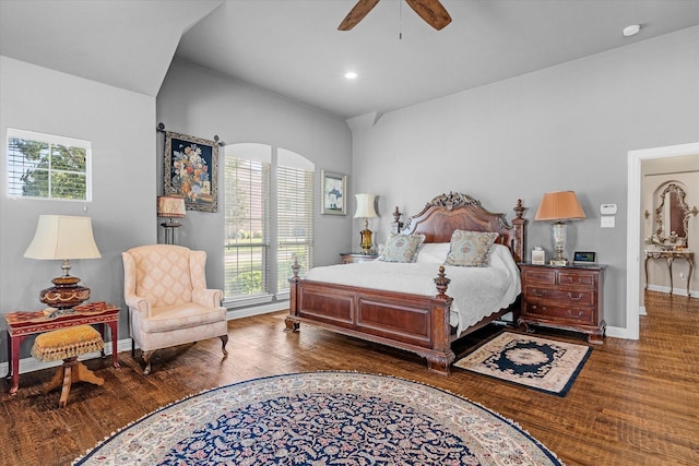 bedroom featuring multiple windows, ceiling fan, and dark wood-type flooring