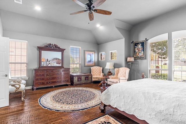 bedroom featuring ceiling fan, dark wood-type flooring, and vaulted ceiling