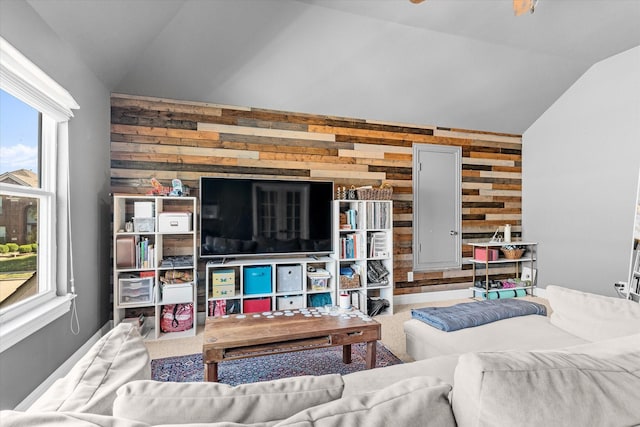 living room featuring wooden walls and vaulted ceiling