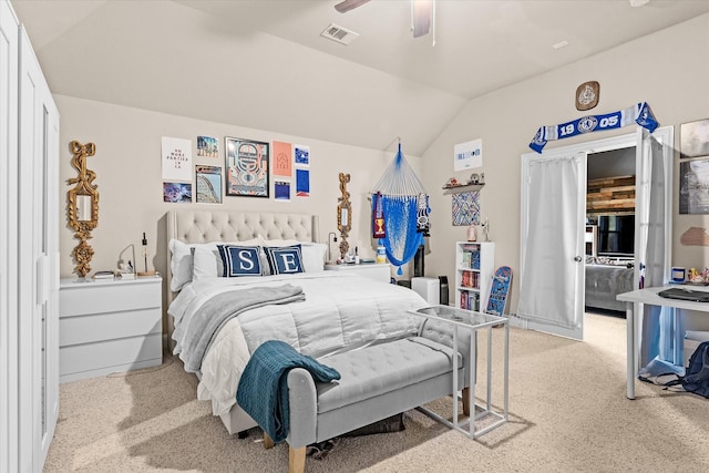 carpeted bedroom with ceiling fan and lofted ceiling