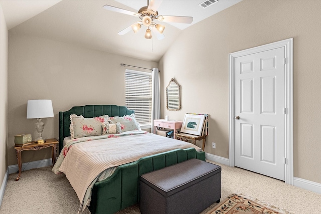 bedroom with ceiling fan, lofted ceiling, and light carpet