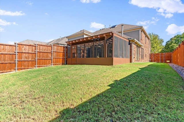 view of yard with a sunroom