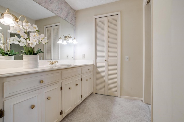 bathroom featuring vanity and a textured ceiling