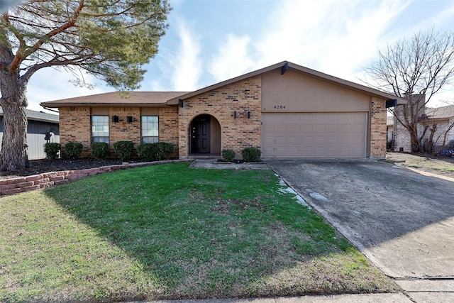 ranch-style house featuring a garage and a front lawn