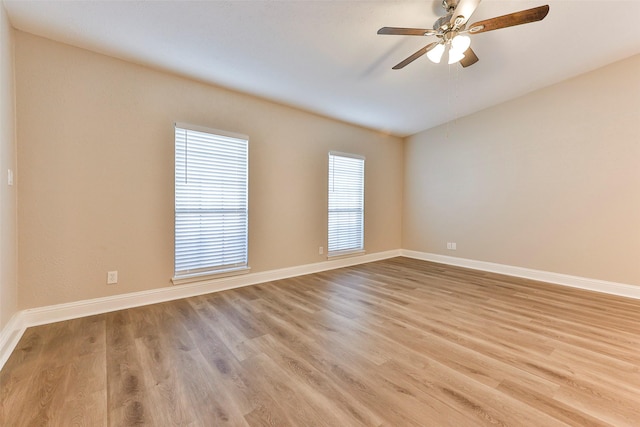 unfurnished room featuring light wood-type flooring and ceiling fan