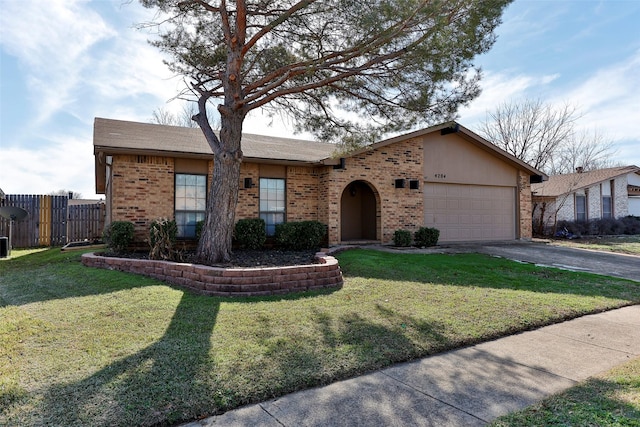 single story home featuring a garage and a front lawn