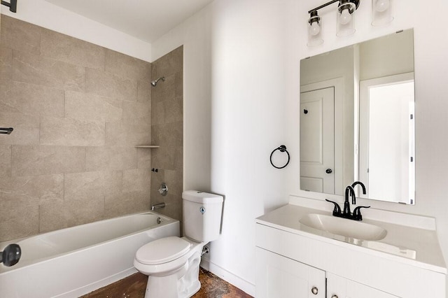 full bathroom featuring tiled shower / bath combo, toilet, and vanity